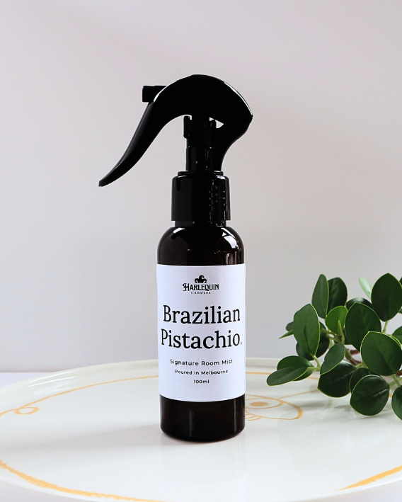 Harlequin Candles Bum Bum Type Brazilian Pistachio 100ml signature room mist in a premium amber spray bottle on a minimalist white ceramic tray, handmade in Melbourne Australia.