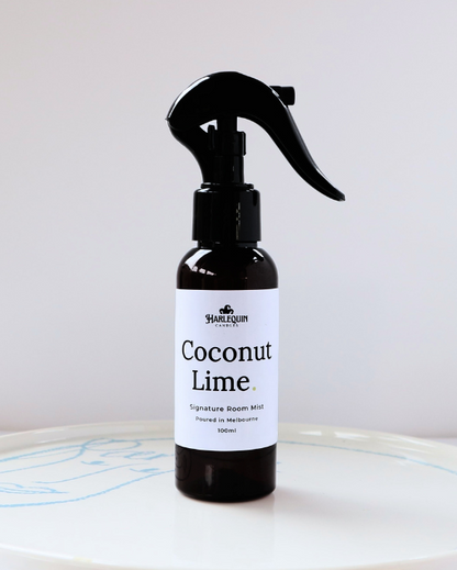 Harlequin Candles Coconut Lime 100ml signature room mist in a premium amber spray bottle on a clean white ceramic tray, handmade in Melbourne Australia.