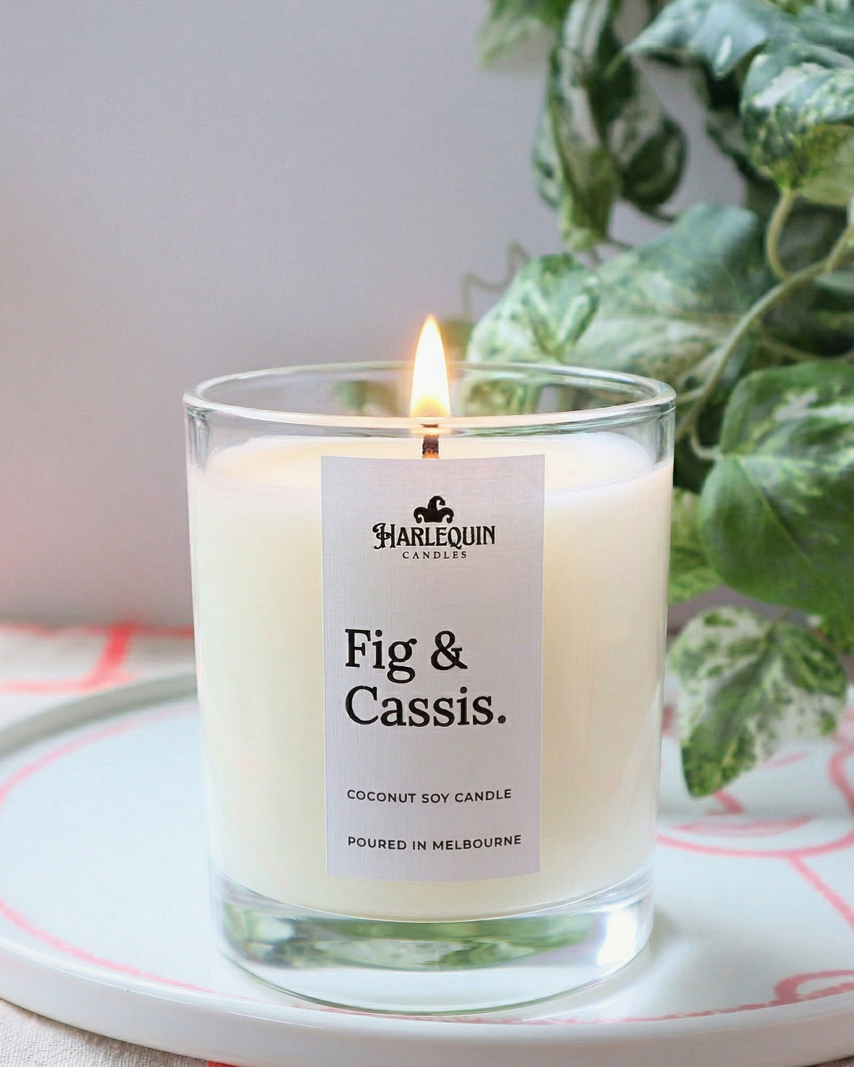 Harlequin Candles Fig and Cassis scented candle in a clear glass jar, poured in Melbourne with high-quality fragrance oils and coconut soy wax.