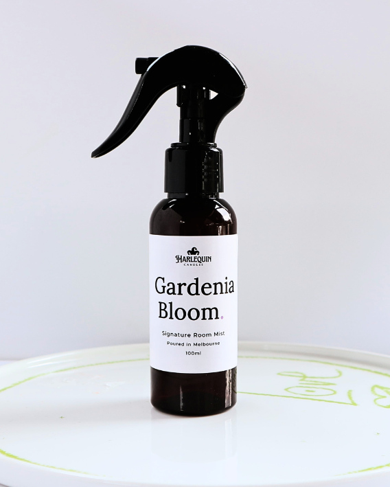 Harlequin Candles Gardenia Bloom 100ml signature room mist in a premium amber spray bottle on a minimalist white ceramic tray, hand-poured in Melbourne Australia.