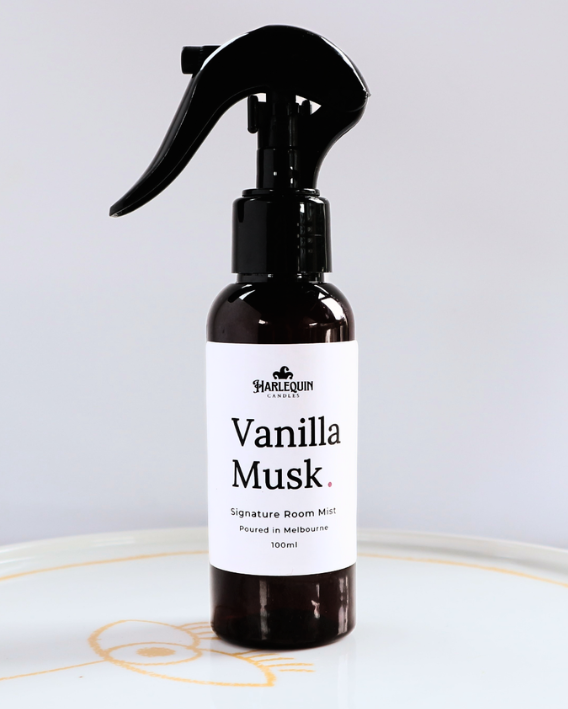 Harlequin Candles Vanilla Musk 100ml signature room mist in a premium amber glass spray bottle on a minimalist white ceramic tray, handmade in Melbourne Australia.